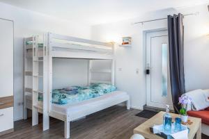 Postel nebo postele na pokoji v ubytování Struthhof