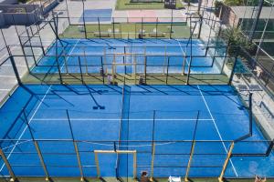 an overhead view of a blue tennis court at TUI Magic Life Candia Maris - Adults Only in Amoudara Herakliou