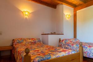 Ένα ή περισσότερα κρεβάτια σε δωμάτιο στο Gîte Gîtes de France 4/6 personnes B