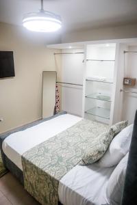 Postel nebo postele na pokoji v ubytování Residencial Nany