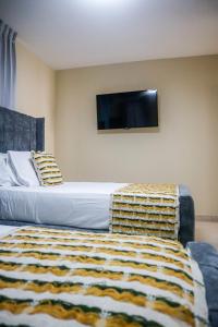 Postel nebo postele na pokoji v ubytování Residencial Nany