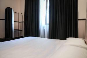 Posteľ alebo postele v izbe v ubytovaní Hotel Universo