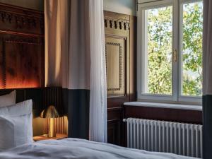 Postel nebo postele na pokoji v ubytování A-ROSA Collection Straubinger Grand Hotel Bad Gastein