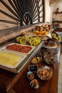 a buffet with many different types of food on a table at Hotel Bia Maore in Baunei