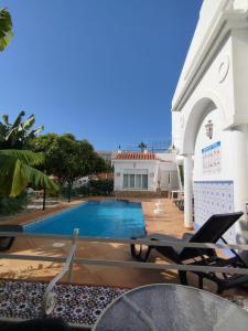 a view of the pool from the patio of a villa at El Jardin BeNerja in Nerja
