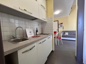 a kitchen with a sink and a counter top at La Casetta in Montagna by Holiday World in Lucoli Alto +12 photos