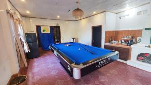 a pool table in the middle of a room at The Fullhouse in Da Lat