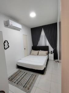 a white bedroom with a bed and a window at AzzSpacesAnderson in Ipoh +13 photos