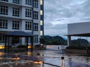 a building with a patio and a building with lights at AzzSpacesAnderson in Ipoh