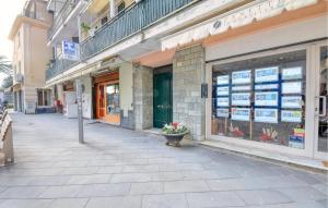 a building with a flower pot on the sidewalk at 2 Bedroom Lovely Apartment In Moneglia in Moneglia +12 photos