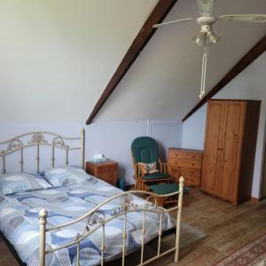 Postel nebo postele na pokoji v ubytování Gite Fontenelles + 6 fotografií