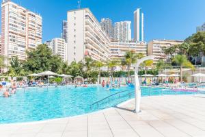 a large swimming pool in a city with people in it at Port Benidorm Hotel & Spa 4* Sup in Benidorm