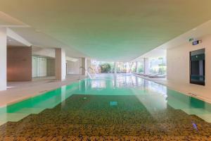 an empty swimming pool in a building at Port Benidorm Hotel & Spa 4* Sup in Benidorm