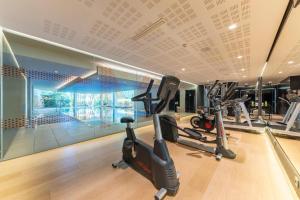 a gym with treadmills and elliptical machines at Port Benidorm Hotel & Spa 4* Sup in Benidorm