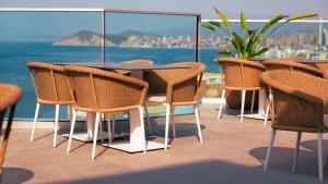 a table and chairs on a balcony with a view at Port Benidorm Hotel & Spa 4* Sup in Benidorm