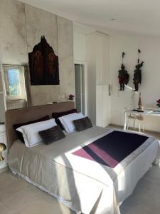 a bedroom with a large bed in a room at Domus Orestea Luxury Suites in Palermo +37 photos
