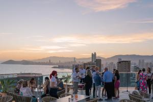 a group of people standing on the roof of a building at Port Benidorm Hotel & Spa 4* Sup in Benidorm