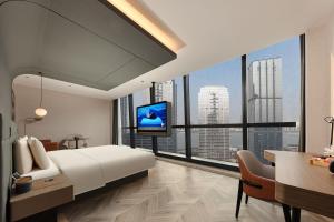 TV a/nebo společenská místnost v ubytování Atour S Hotel Wuhan Wuchang River Beach