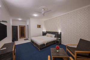 Postel nebo postele na pokoji v ubytování Echor Kashmir Holidays Resort Srinagar