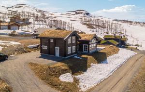 a small house on the side of a dirt road at Stunninng Home In Rauland With Sauna in Rauland +10 photos