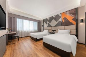 Voodi või voodid majutusasutuse Feifanchengpin Hotel Xinhui Pedestrian Street Branch toas