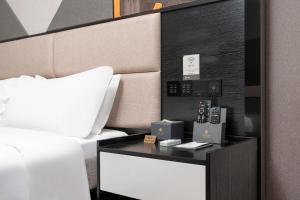 Voodi või voodid majutusasutuse Feifanchengpin Hotel Xinhui Pedestrian Street Branch toas