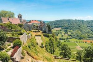 an aerial view of a house on a hill at Studio du Jura in Lons-le-Saunier