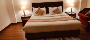 Postel nebo postele na pokoji v ubytování GOODWILL HOTEL