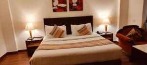 Postel nebo postele na pokoji v ubytování GOODWILL HOTEL