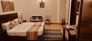 Postel nebo postele na pokoji v ubytování GOODWILL HOTEL