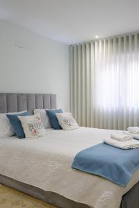 Ένα ή περισσότερα κρεβάτια σε δωμάτιο στο Dunas Ria Apartment T2