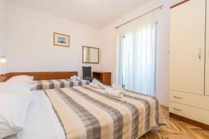 Posteľ alebo postele v izbe v ubytovaní Apartment Ivo