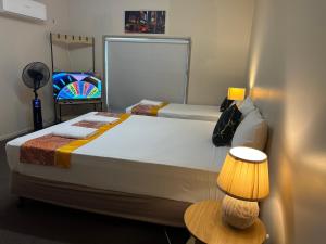Postel nebo postele na pokoji v ubytování Kalua Motel