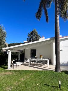 a patio with a table and chairs on a house at Domus Orestea Luxury Suites in Palermo