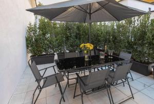 Κήπος έξω από το Aiello Hotels - CityLife Apartments
