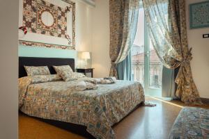 Postel nebo postele na pokoji v ubytování Le Meraviglie della Sicilia + 46 fotografií