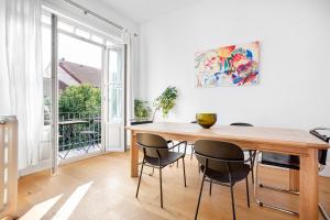 a dining room with a wooden table and chairs at NOA - Lüleci Hendek 54 in Istanbul