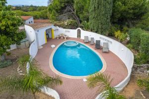 an overhead view of a swimming pool in a backyard at Villa Felicity in Porches