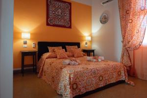 Postel nebo postele na pokoji v ubytování Le Meraviglie della Sicilia