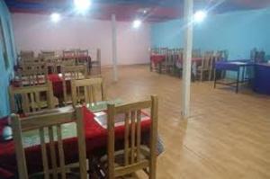 a room with chairs and a table in a room at Tsomoriri Inn Cottages in Karzok Gömpa