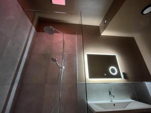 a bathroom with a shower and a sink at Apartment Riga Purvciems in Rīga +7 photos