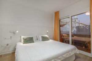 Łóżko lub łóżka w pokoju w obiekcie Apartamento sobre el rio Guadiana
