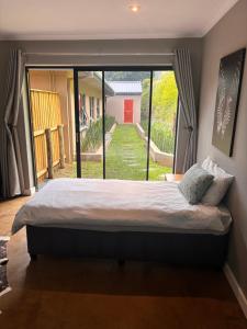 Postel nebo postele na pokoji v ubytování Hilton Splendour 1