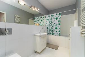a bathroom with a toilet and a sink at Wyspa Słodowa Serenity Studio in Wrocław +18 photos