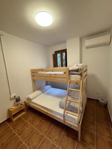 a room with two bunk beds and a ladder at Paraiso Natural Unico -Villa Cueva Turche in Valencia +100 photos