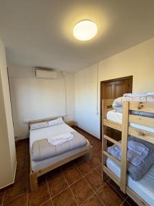 a room with two bunk beds and a light at Paraiso Natural Unico -Villa Cueva Turche in Valencia