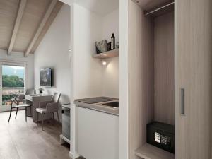 TV a/nebo společenská místnost v ubytování Residence Caffè Maya