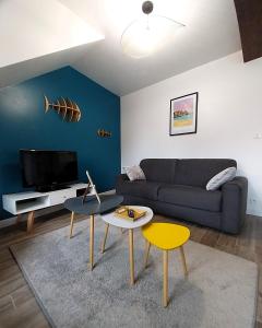 TV a/nebo společenská místnost v ubytování Charmant appartement bord de mer