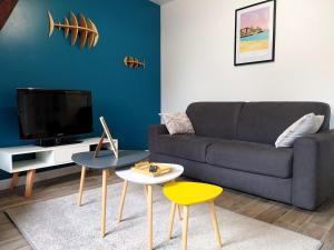 TV a/nebo společenská místnost v ubytování Charmant appartement bord de mer