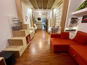 a living room with a couch and some boxes at Loft - Pioltello in Pioltello